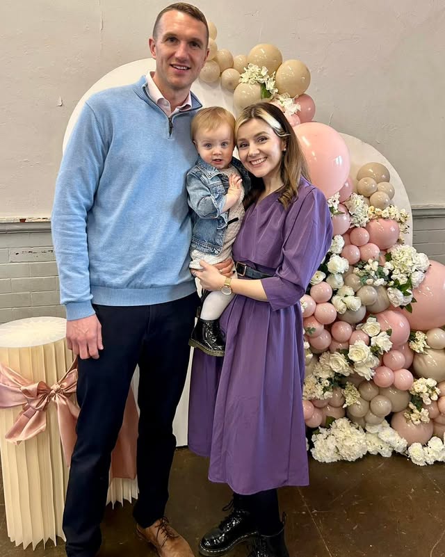 The Everleigh & Co family — the couple and their daughter Everleigh with balloons